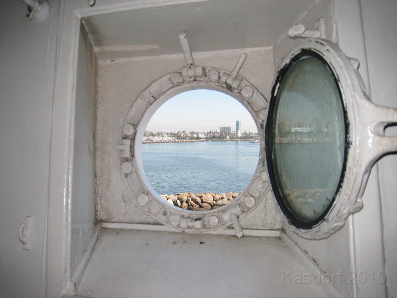 Queen Mary 2010 0210.JPG - View of LA from a Queen Mary porthole.